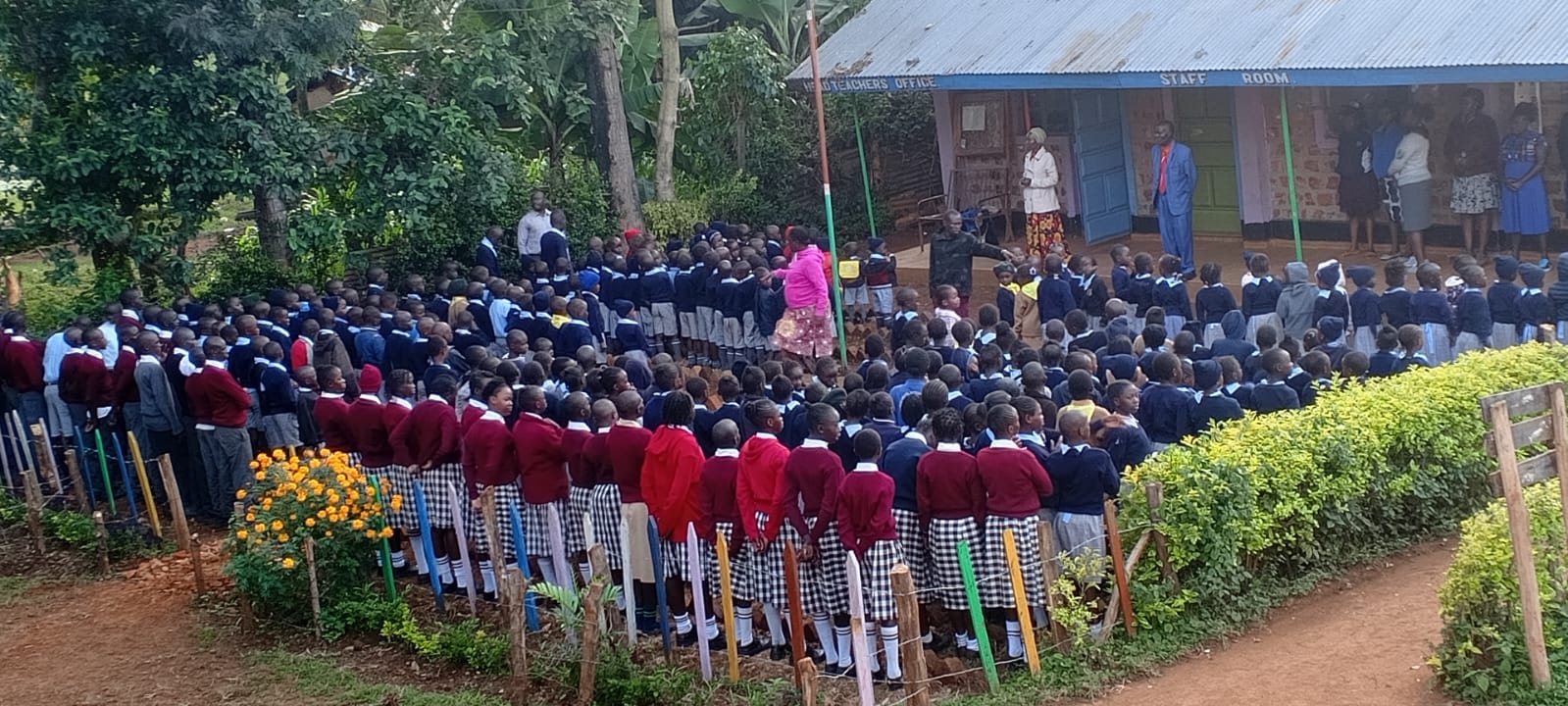 Wide view of Immanuel pupils lined up outside the staff room